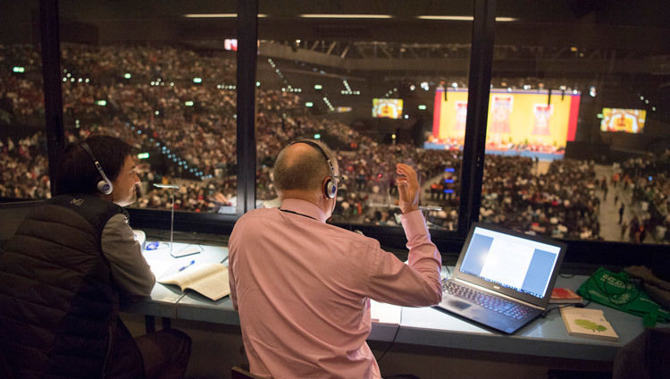 One of several interpreters at His Holiness the Dalai Lama's teaching at the Hallenstadion in Zurich, Switzerland on October 14, 2016. Photo/Manuel Bauer