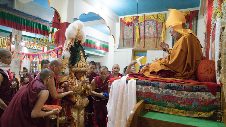 The Nechung Oracle approaching His Holiness the Dalai Lama during the Long Life ceremony at Drepung Lachi Assembly Hall in Mundgod, Karnataka, India on December 21, 2016. Photo/Tenzin Choejor/OHHDL