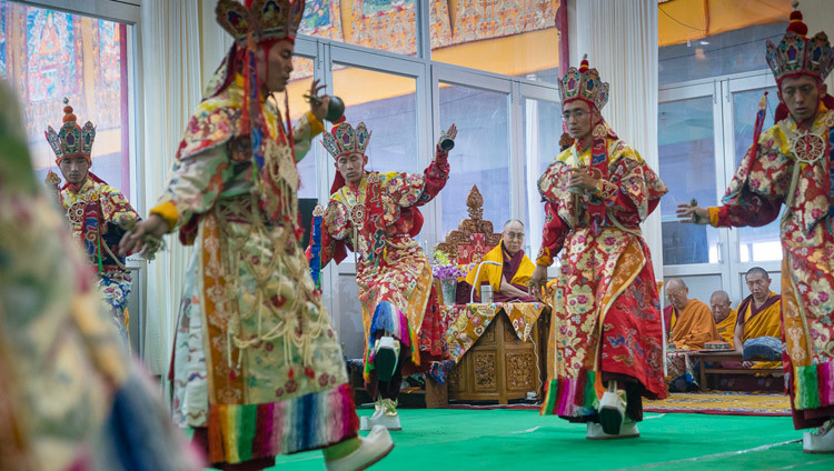 His Holiness the Dalai Lama looks on as monks from Namgyal Monastery perform the Earth Ritual Dance on the second day of preparations for the Kalachakra Empowerment in Bodhgaya, Bihar, India on January 3, 2017. Photo/Tenzin Choejor/OHHDL