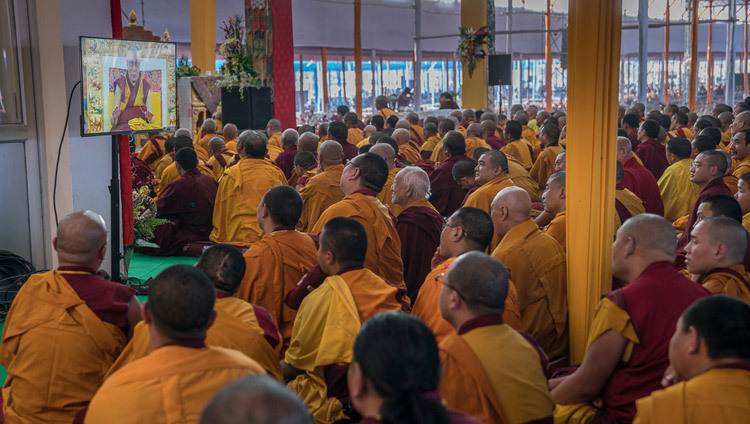 Members of the monastic community watching His Holiness the Dalai Lama on a TV during final day of teachings preliminary to the Kalachakra Empowerment in Bodhgaya, Bihar, India on January 8, 2017. Photo/Tenzin Choejor/OHHDL