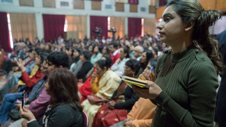 A student taking notes as His Holiness the Dalai Lama answers her question during his talk at Jesus & Mary College in New Delhi, India on February 7, 2017. Photo/Tenzin Choejor/OHHDL