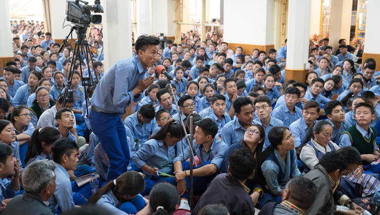 A student asking His Holiness the Dalai Lama a question during the second day of teachings for Tibetan youth at the Main Tibetan Temple in Dharamsala, HP, India on June 6, 2017. Photo by Tenzin Choejor/OHHDL