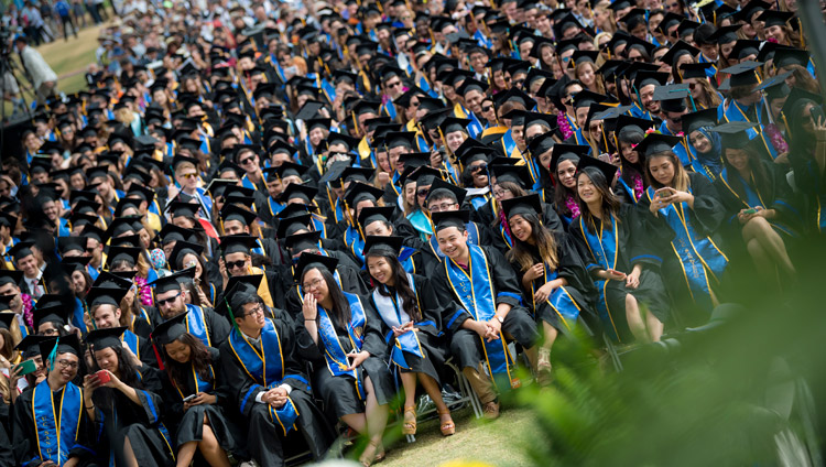 Graduates attending the UCSD Commencement ceremony listening to His Holiness the Dalai Lama delivering the Keynote Address at RIMAC Field in San Diego, CA, on June 17, 2017. Photo by Erik Jepsen/UC San Diego