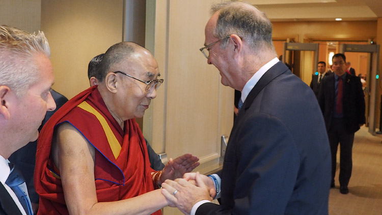 His Holiness the Dalai Lama greeting Anaheim Mayor Tom Tait as he prepares to meet with school principals and teachers in Newport Beach, CA, USA on June 20, 2017. Photo by Jeremy Russell/OHHDL