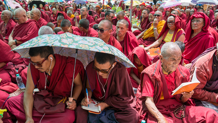 Members of the monastic community following the text during the first day of His Holiness the Dalai Lama's teachings in Disket, Nubra Valley, J&K, India on July 11, 2017. Photo by Tenzin Choejor/OHHDL