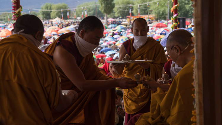 Assistants handing His Holiness the Dalai Lama ritual offerings during the Long-Life Empowerment in Leh, Ladakh, J&K, India on July 30, 2017. Photo by Tenzin Choejor/OHHDL