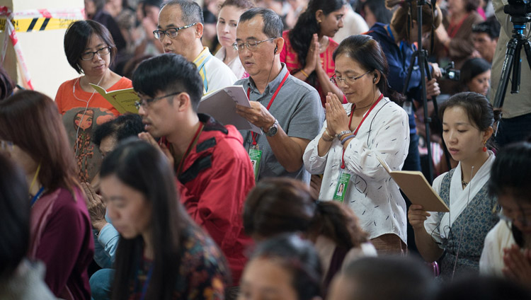 Members of the audience from SE Asia following His Holiness the Dalai Lama as he conducts rites for generating the awakening mind of bodhichitta on the final day of his teaching for SE Asians at the Tsuglagkhang in Dharamsala, HP, India on September 1, 2017. Photo by Tenzin Choejor/OHHDL