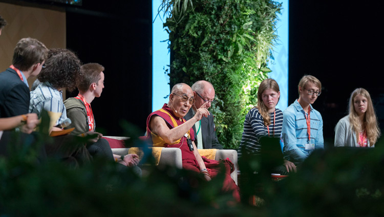 His Holiness the Dalai Lama answering questions from students sitting on stage during their dialogue at the Jahrhunderthalle in Frankfurt, Germany on September 13, 2017. Photo by Tenzin Choejor