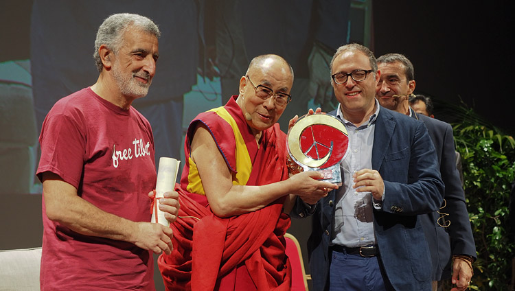 His Holiness the Dalai Lama receiving Messina’s ‘Builder of Peace, Justice and Nonviolence Prize’ during his talk at the Vittorio Emanuele Theatre in Messina, Sicily, Italy on September 17, 2017. Photo by Jeremy Russell