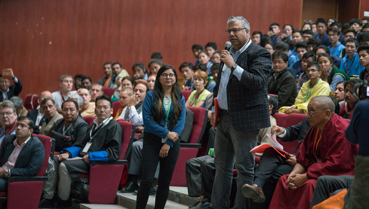 A member of the audience asking His Holiness the Dalai Lama a question during the inaugural session of the conference on Science, Spirituality & World Peace in Dharamsala, HP, India on November 4, 2017. Photo by Tenzin Choejor